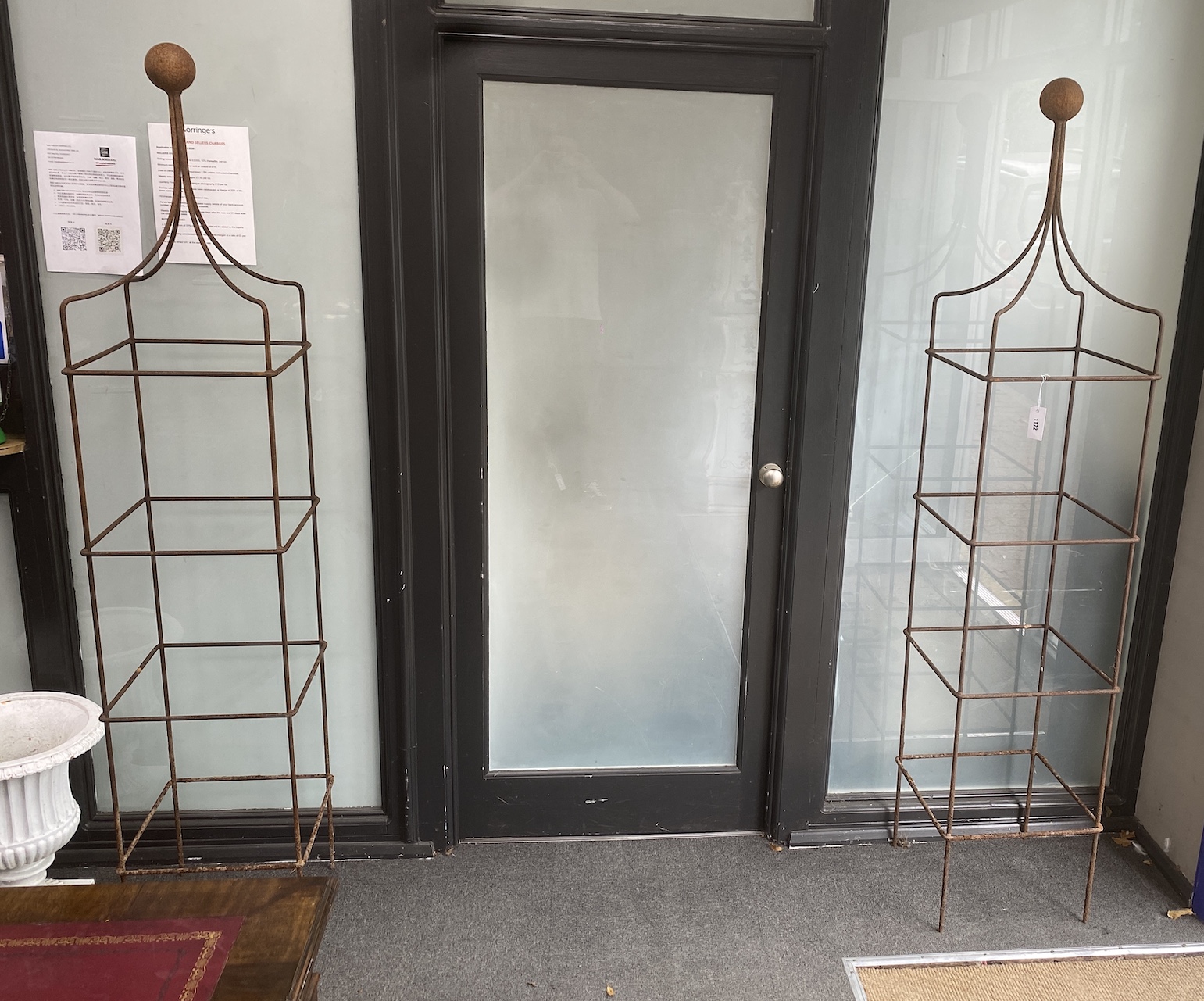 Two wrought iron garden obelisk growing frames, height 194cm
